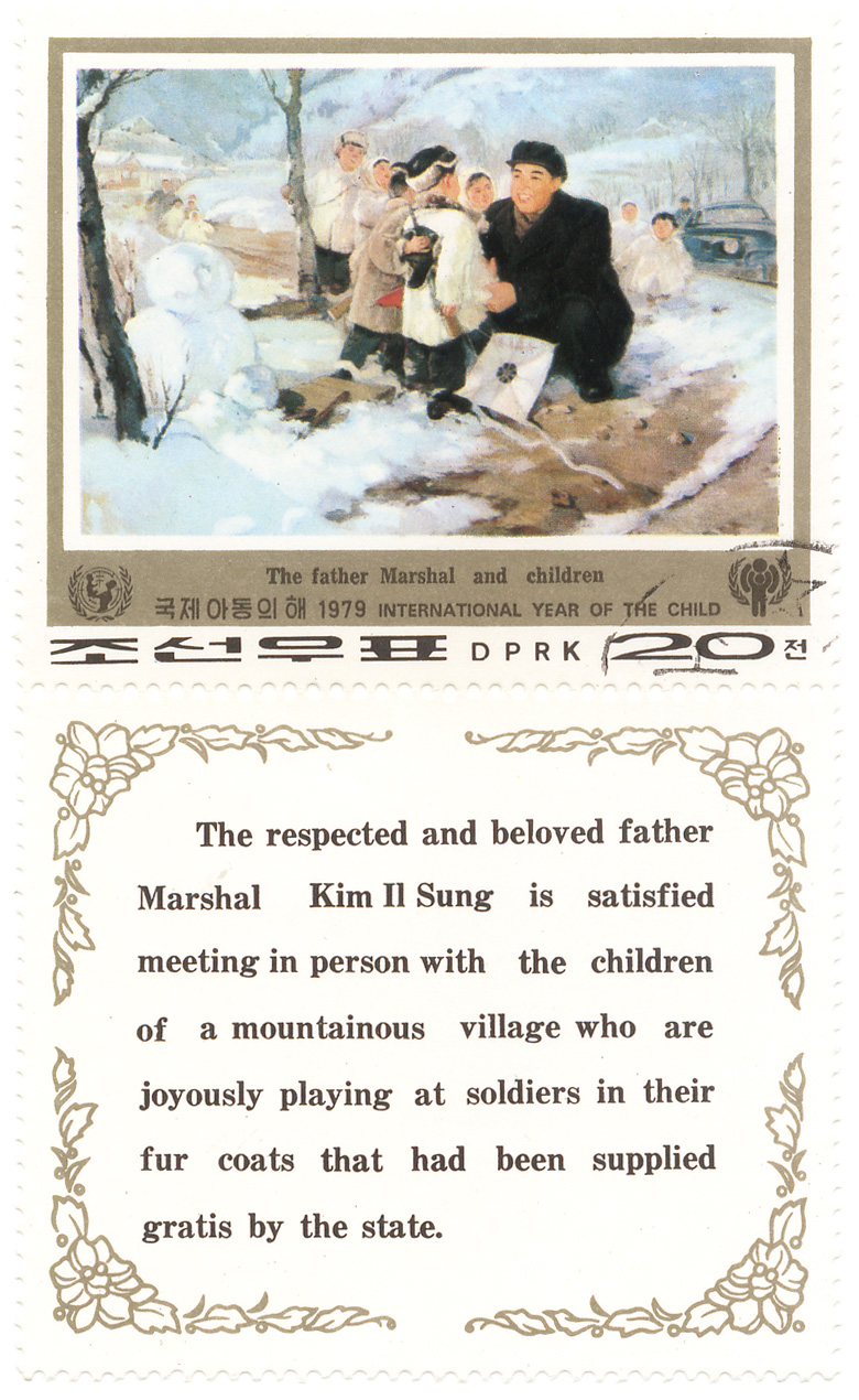 1979 International year of the child -  The father Marshal and children - The respected and beloved father Marshal Kim Il Sung is satitsfied meeting in person with the children of a mountainous village who are joyously playing at soldiers in their fur coats that had been supplied gratis by the state.